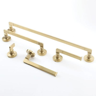 The Origins Living Baxter bathroom accessory collection. Image shows towel rails, toilet roll holder and bathroom hook, all in brushed brass and against a plain white background