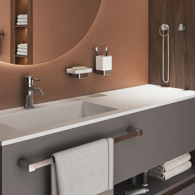 The Gedy Spluga bathroom accessory collection from Origins Living. Image shows a chrome towel rail, soap dish, tumber and hooks in a modern bathroom setting.