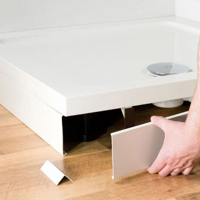 Shop shower tray riser kits at BathLab.co.uk - image shows a riser kit being fitted to a white shower tray, showing the legs and panels